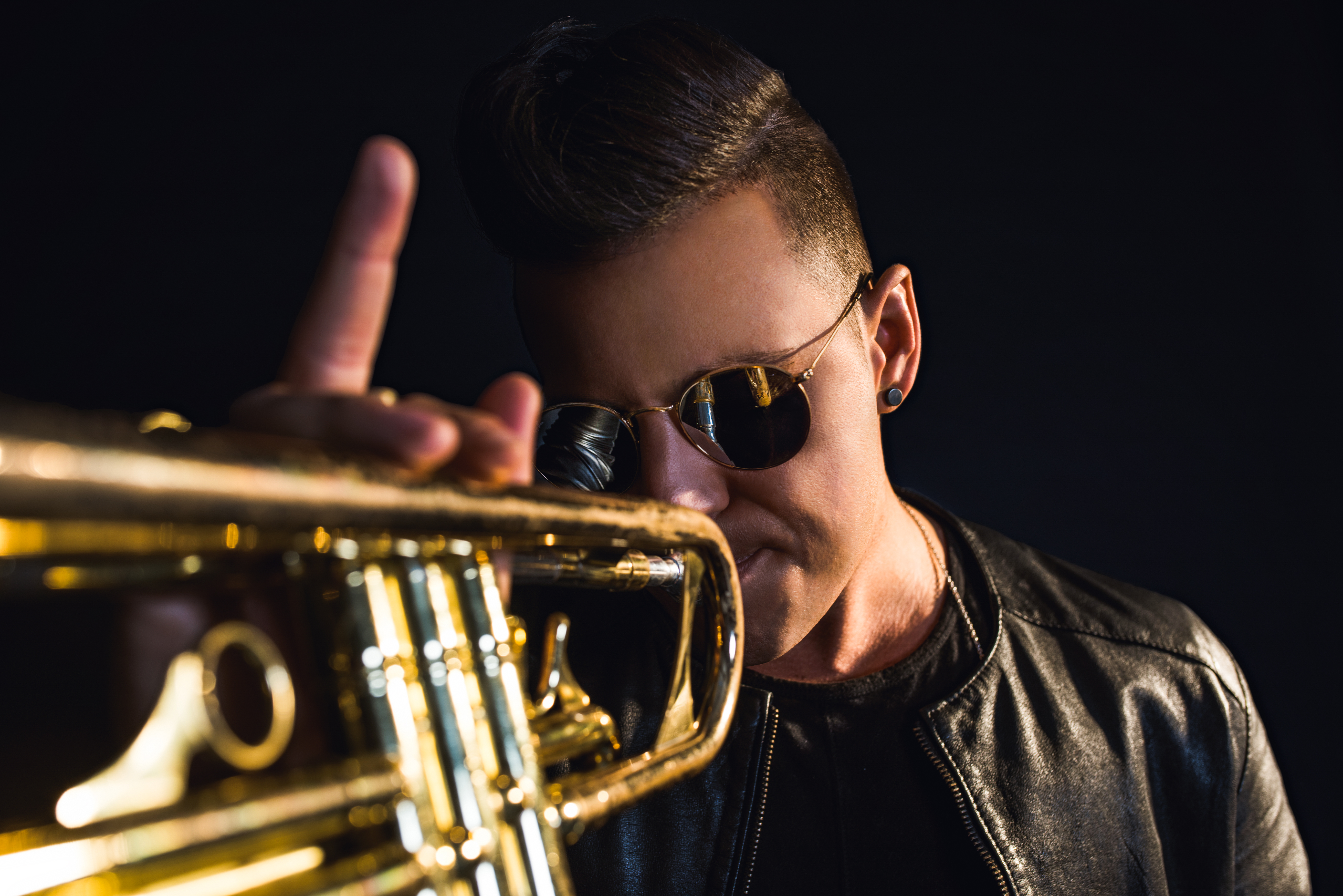 Musician Timmy Trumpet reacts after throwing out a ceremonial
